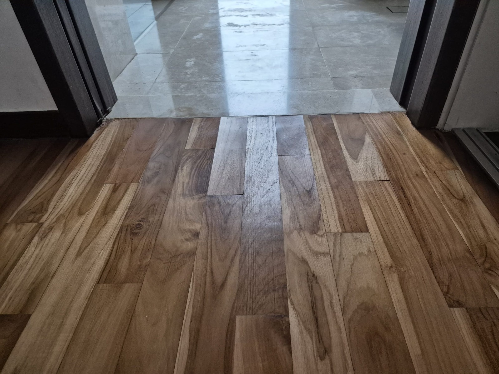 A small patched section of parquet flooring repaired without redoing the whole floor